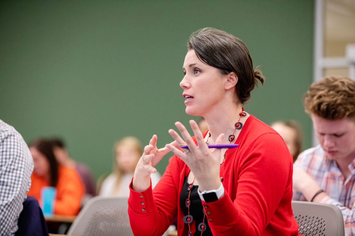 A female professor lectures during a College of Applied Health Sciences class in the Khan Annex.